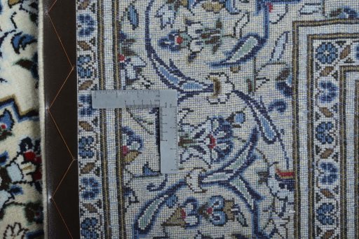 Backside of handmade 2000s Kashan rug showing knot structure and weave density