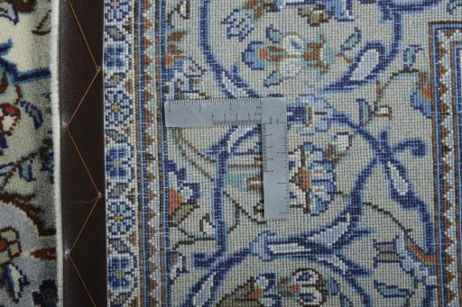 Backside of handmade 2000s Kashan rug showing knot structure and weave density
