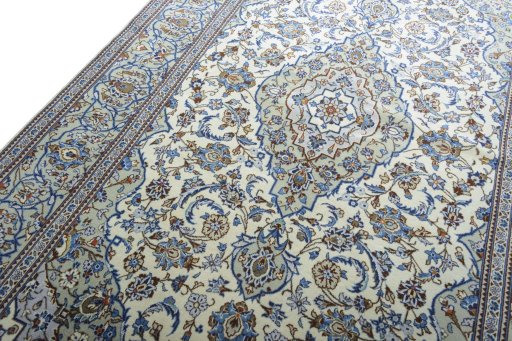 Backside of handmade 2000s Kashan rug showing knot structure and weave density
