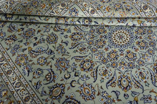 Close-up detail of 2000s Kashan rug from Iran / Persia showing Wool weave
