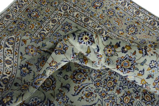 Surface texture of 2000s Kashan rug with natural Wool and intricate pattern