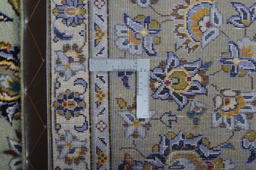 Backside of handmade 2000s Kashan rug showing knot structure and weave density