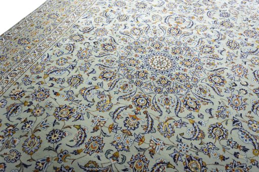 Backside of handmade 2000s Kashan rug showing knot structure and weave density