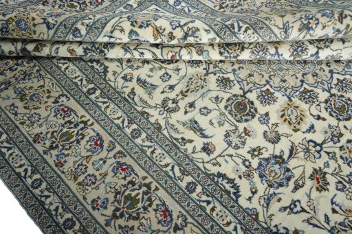 Close-up detail of 2000s Kashan rug from Iran / Persia showing Wool weave