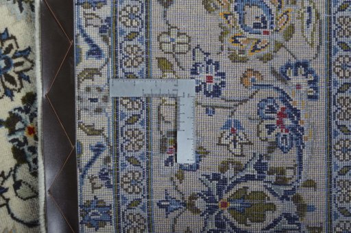 Backside of handmade 2000s Kashan rug showing knot structure and weave density