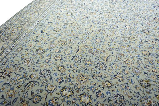 Backside of handmade 2000s Kashan rug showing knot structure and weave density