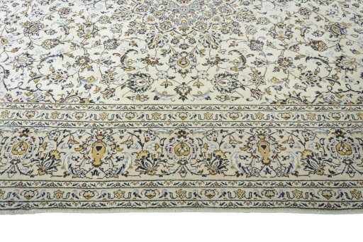 Corner detail of 2000s Kashan rug showing border pattern and Wool pile