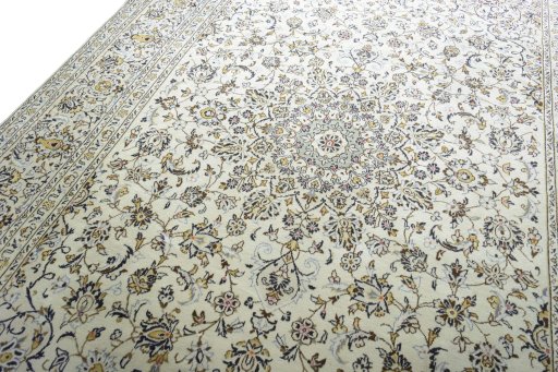 Backside of handmade 2000s Kashan rug showing knot structure and weave density