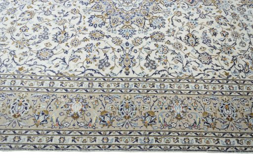 Corner detail of 2000s Kashan rug showing border pattern and Wool pile