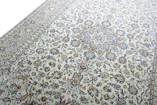 Backside of handmade 2000s Kashan rug showing knot structure and weave density