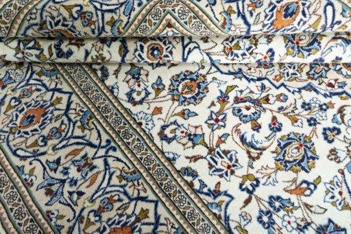 Close-up detail of 2000s Kashan rug from Iran / Persia showing Wool weave