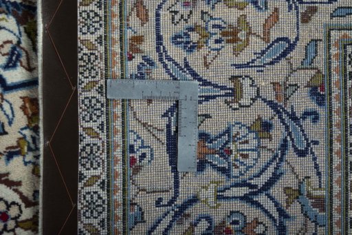 Backside of handmade 2000s Kashan rug showing knot structure and weave density