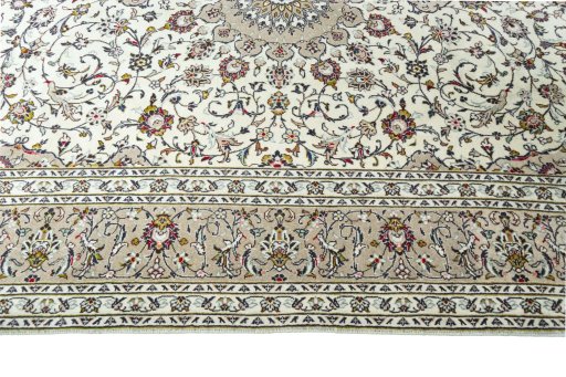 Corner detail of New Kashan rug showing border pattern and Wool pile