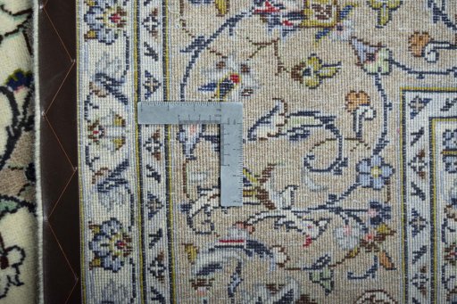 Backside of handmade New Kashan rug showing knot structure and weave density