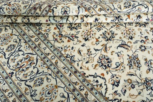 Close-up detail of 2000s Kashan rug from Iran / Persia showing Wool weave