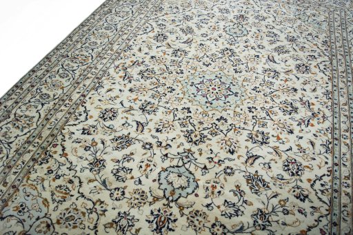 Backside of handmade 2000s Kashan rug showing knot structure and weave density