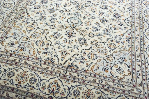 Close-up detail of 2000s Kashan rug from Iran / Persia showing Wool weave