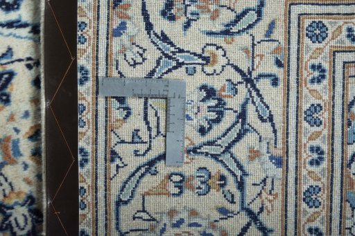 Backside of handmade New Kashan rug showing knot structure and weave density