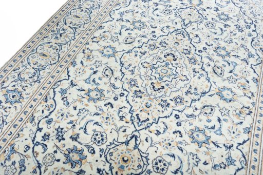 Backside of handmade New Kashan rug showing knot structure and weave density