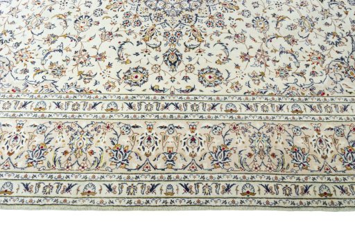 Corner detail of New Kashan rug showing border pattern and Wool pile