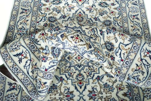 Close-up detail of 2000s Kashan rug from Iran / Persia showing Wool weave