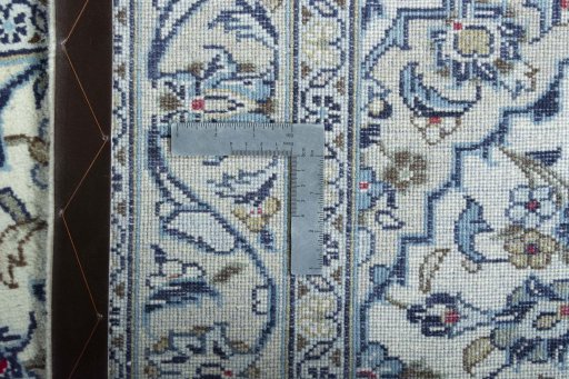 Surface texture of 2000s Kashan rug with natural Wool and intricate pattern