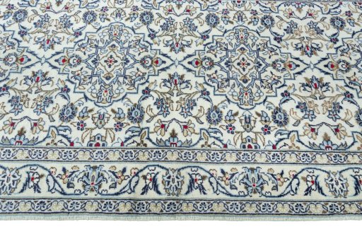 Close-up detail of 2000s Kashan rug from Iran / Persia showing Wool weave