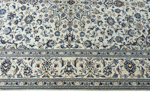Corner detail of New Kashan rug showing border pattern and Wool pile
