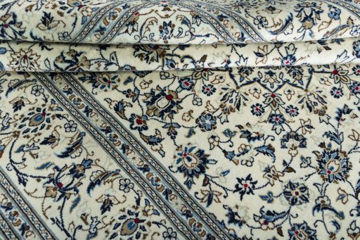 Close-up detail of New Kashan rug from Iran / Persia showing Wool weave