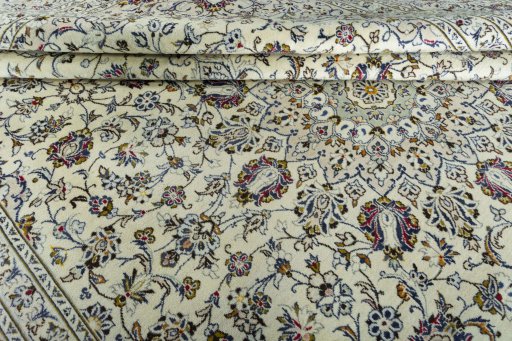 Close-up detail of 2000s Kashan rug from Iran / Persia showing Wool weave