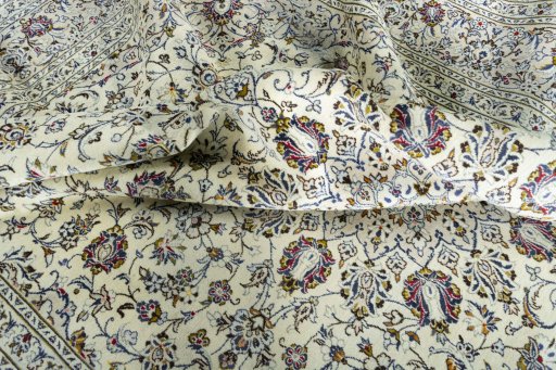 Surface texture of 2000s Kashan rug with natural Wool and intricate pattern