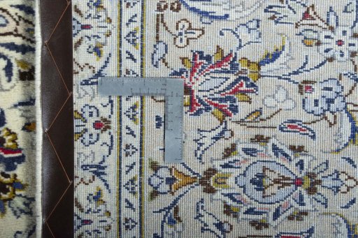 Backside of handmade 2000s Kashan rug showing knot structure and weave density