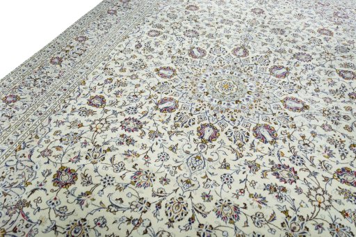 Backside of handmade 2000s Kashan rug showing knot structure and weave density