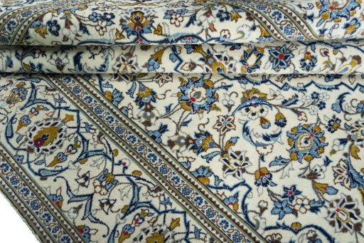 Close-up detail of 2000s Kashan rug from Iran / Persia showing Wool weave