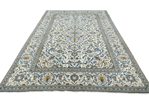 Surface texture of 2000s Kashan rug with natural Wool and intricate pattern