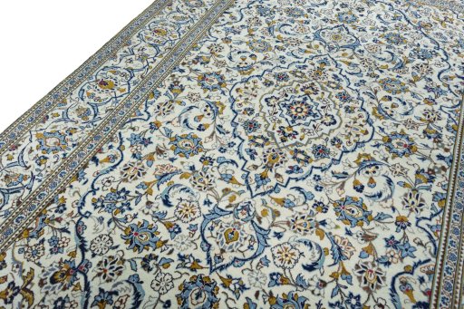 Backside of handmade 2000s Kashan rug showing knot structure and weave density