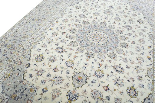 Backside of handmade 2000s Kashan rug showing knot structure and weave density