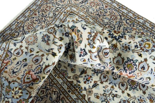 Surface texture of 2000s Kashan rug with natural Wool and intricate pattern