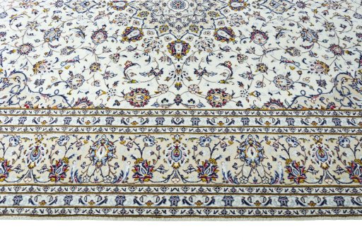 Corner detail of 2000s Kashan rug showing border pattern and Wool pile