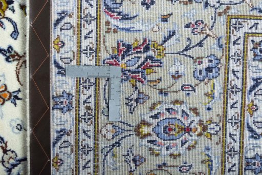 Backside of handmade 2000s Kashan rug showing knot structure and weave density