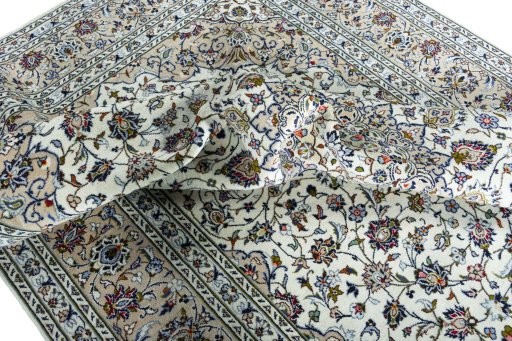 Surface texture of 2000s Kashan rug with natural Wool and intricate pattern