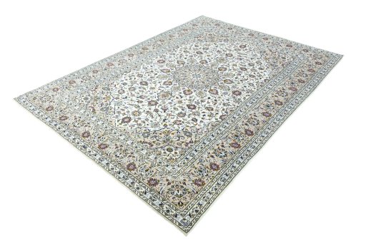 Corner detail of 2000s Kashan rug showing border pattern and Wool pile