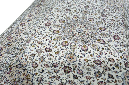 Backside of handmade 2000s Kashan rug showing knot structure and weave density