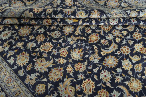 Close-up detail of 2000s Kashan rug from Iran / Persia showing Wool weave