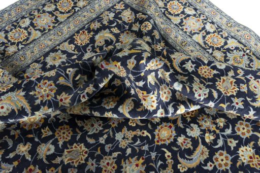 Surface texture of 2000s Kashan rug with natural Wool and intricate pattern