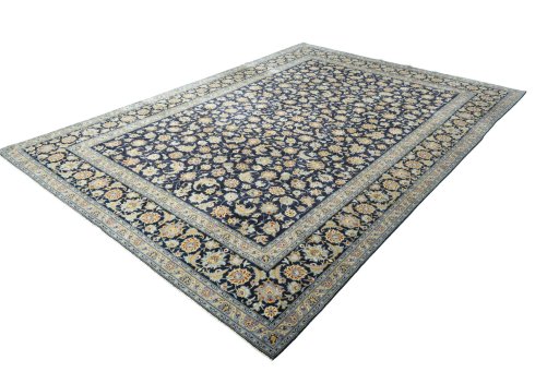 Corner detail of 2000s Kashan rug showing border pattern and Wool pile