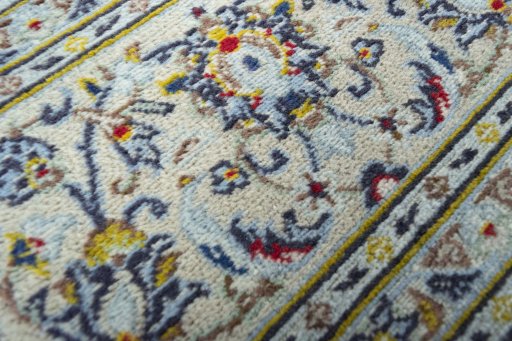 Close-up detail of 2000s Kashan rug from Iran / Persia showing Wool weave