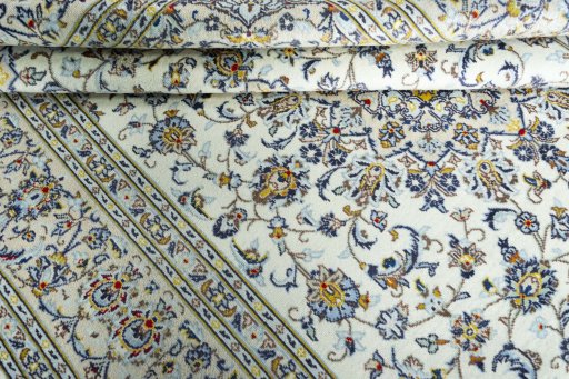 Surface texture of 2000s Kashan rug with natural Wool and intricate pattern