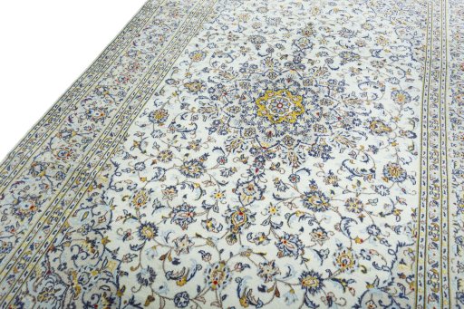 Backside of handmade 2000s Kashan rug showing knot structure and weave density