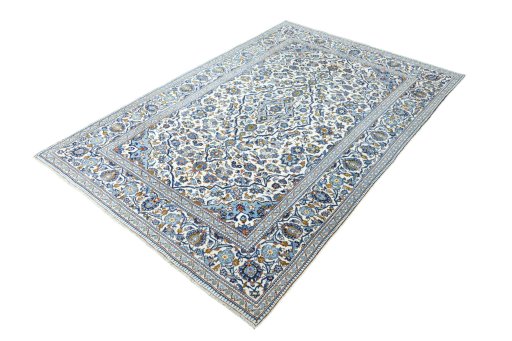 Corner detail of 2000s Kashan rug showing border pattern and Wool pile
